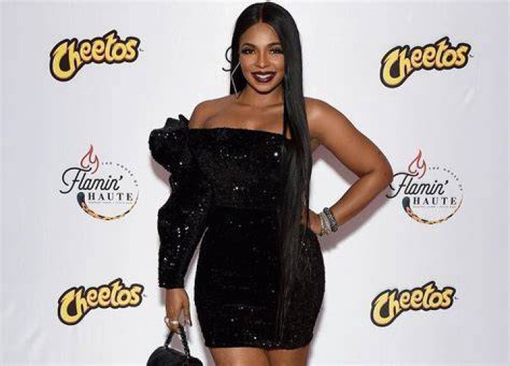 Ashanti Is No Match For This Gorgeous Stallion In This Photo Despite Wearing A Leather Swimsuit