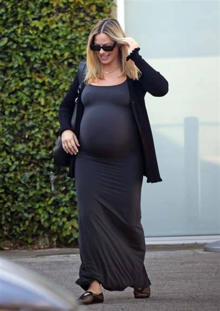 Emma Robert Shows Off Her Baby Bump In These Profile Photos