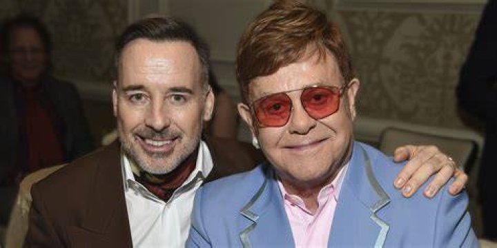 How long have Elton John and his husband been together?