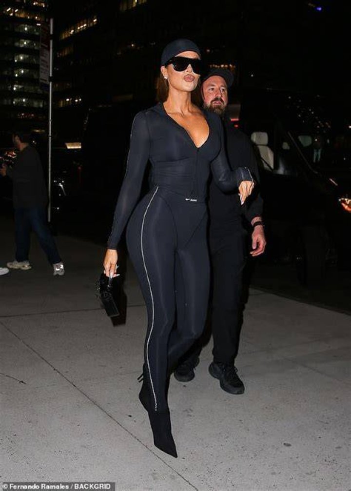 Kim Kardashian Puts Her Curves On Full Display In Two-Piece, Reflective Bathing Suit