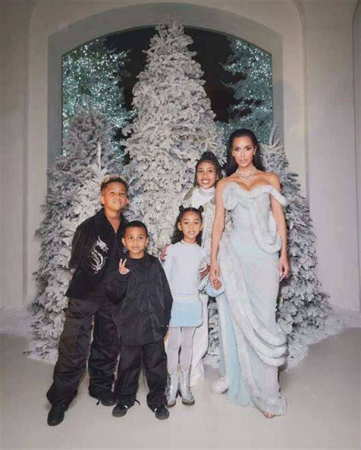 Kourtney Kardashian’s dead eyes are the star of the Kardashian Christmas photo