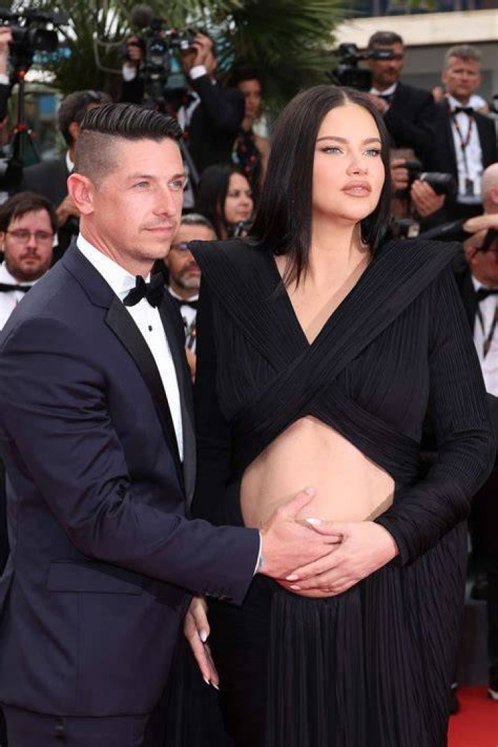 Pregnant Adriana Lima took to the red carpet of Cannes with a bare belly