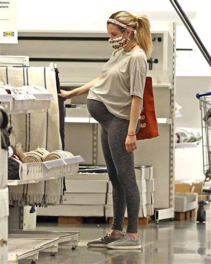 Pregnant Emma Roberts Shows Off Her Growing Baby Bump In Short Mini Dress — See The Look
