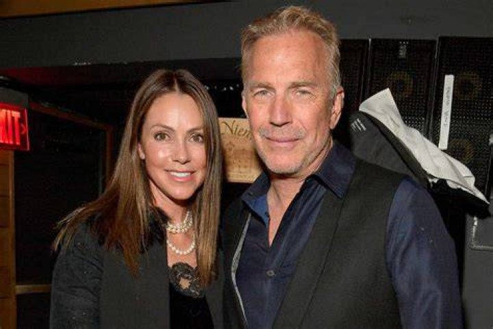 What is the age difference between Kevin Costner and Christine Baumgartner?
