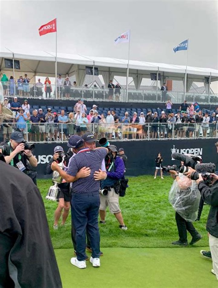 Who is J. J. Spaun's father John Spaun?